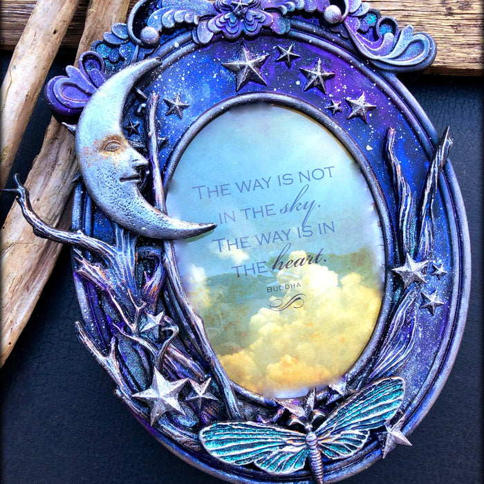 Altered plastic frame by LOUISE CROSBIE